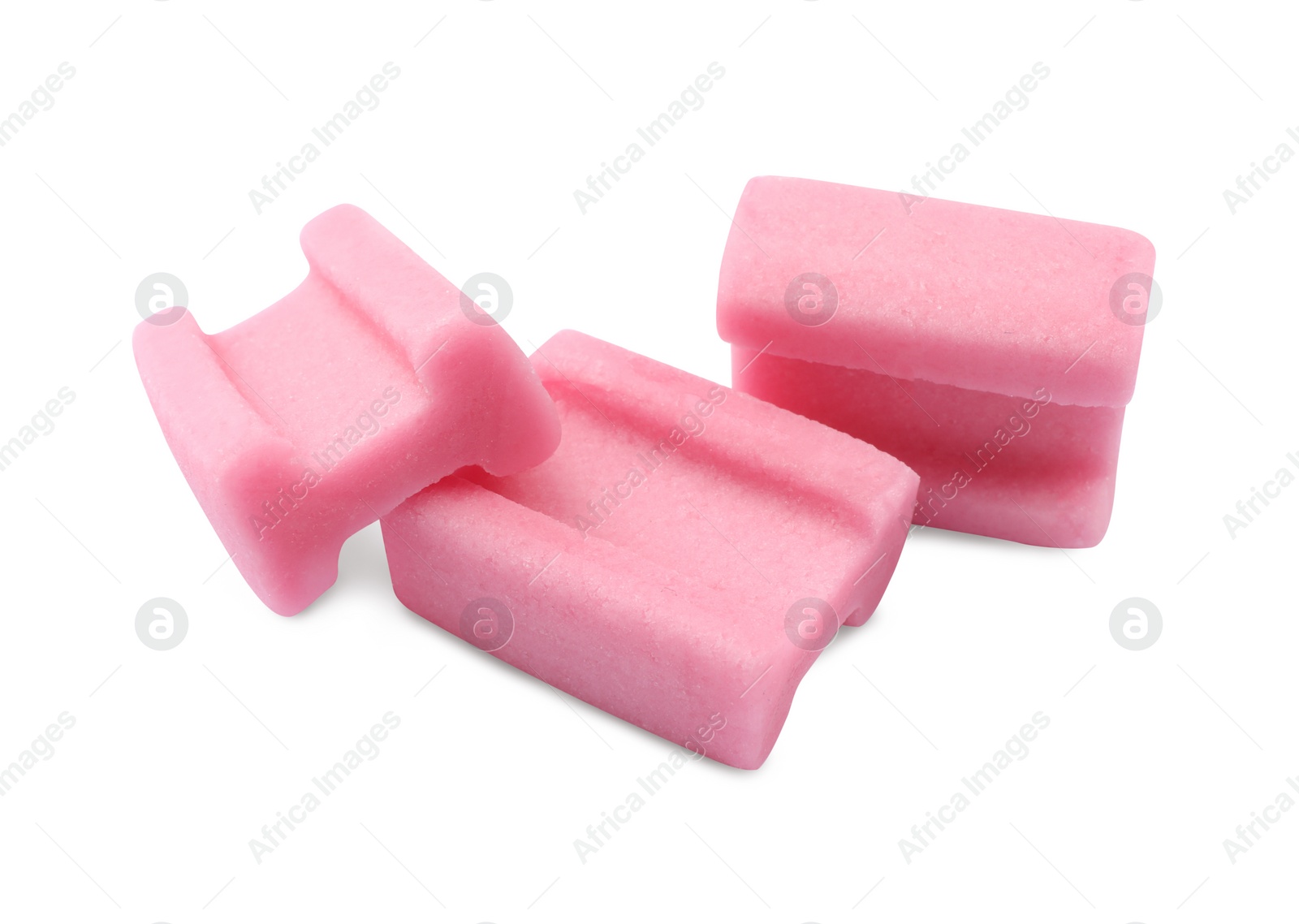 Photo of Tasty pink chewing gums on white background