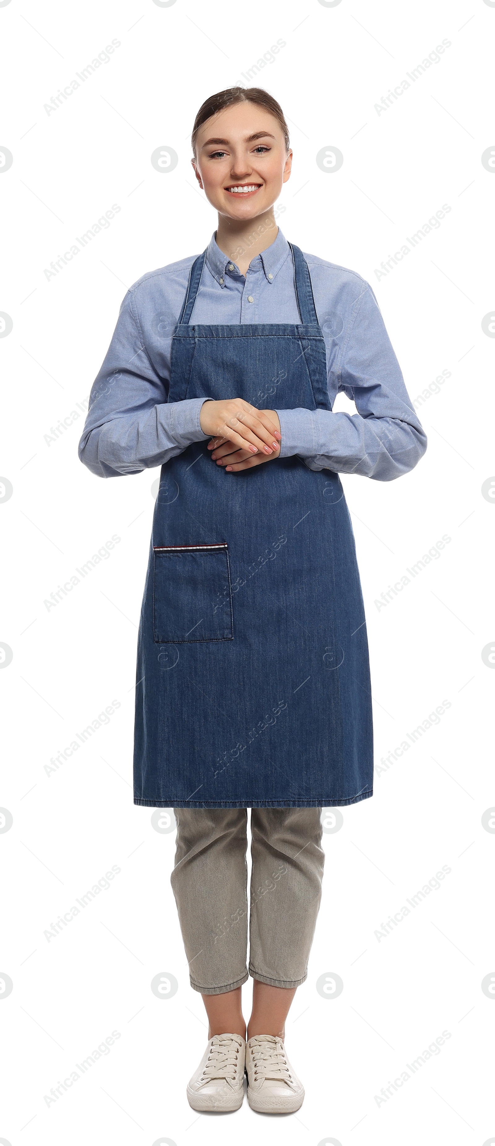 Photo of Beautiful young woman in clean denim apron on white background