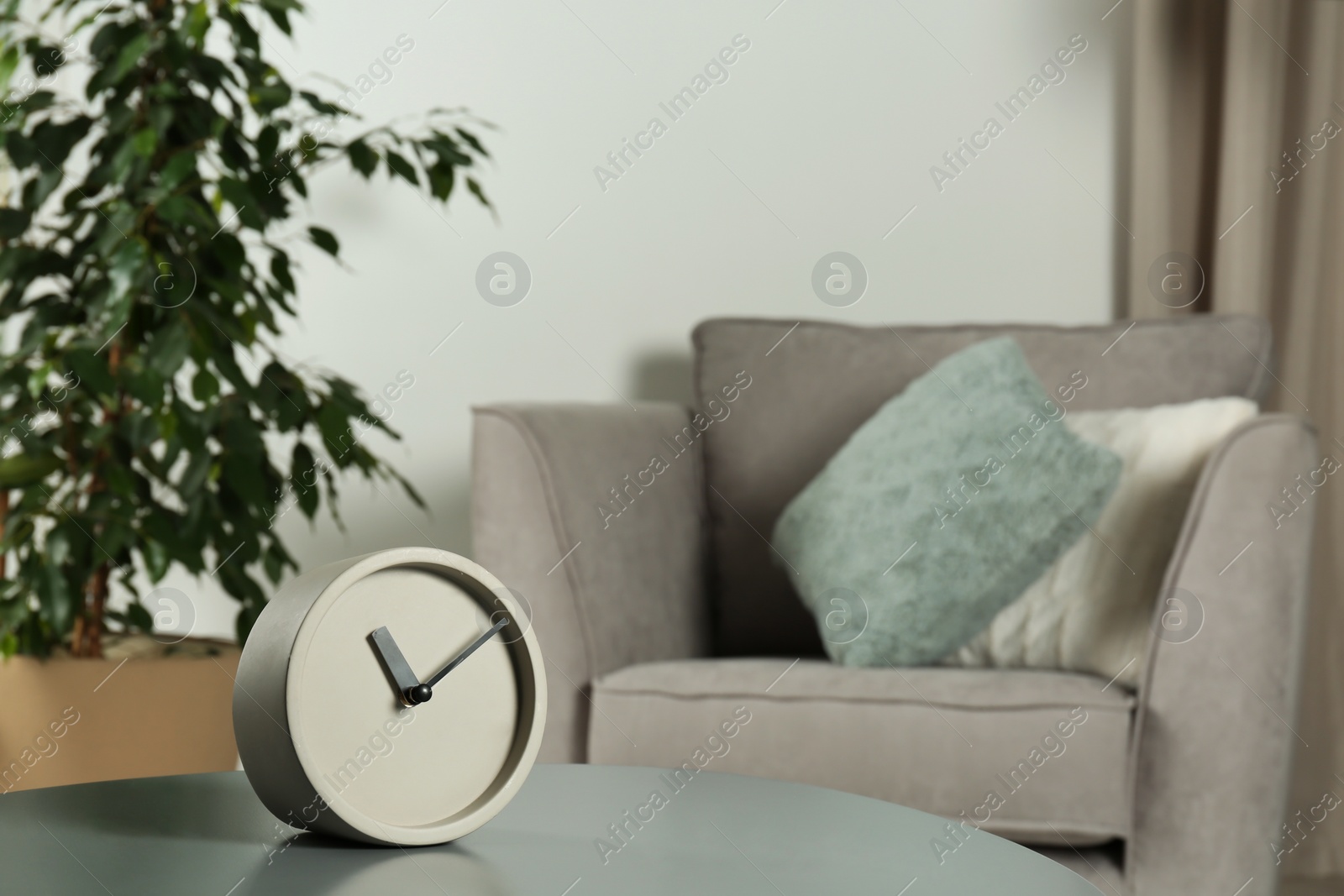 Photo of Analog clock on table indoors, space for text. Time management