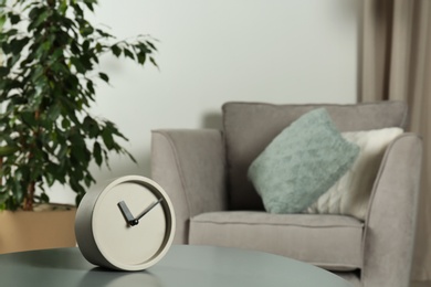 Analog clock on table indoors, space for text. Time management