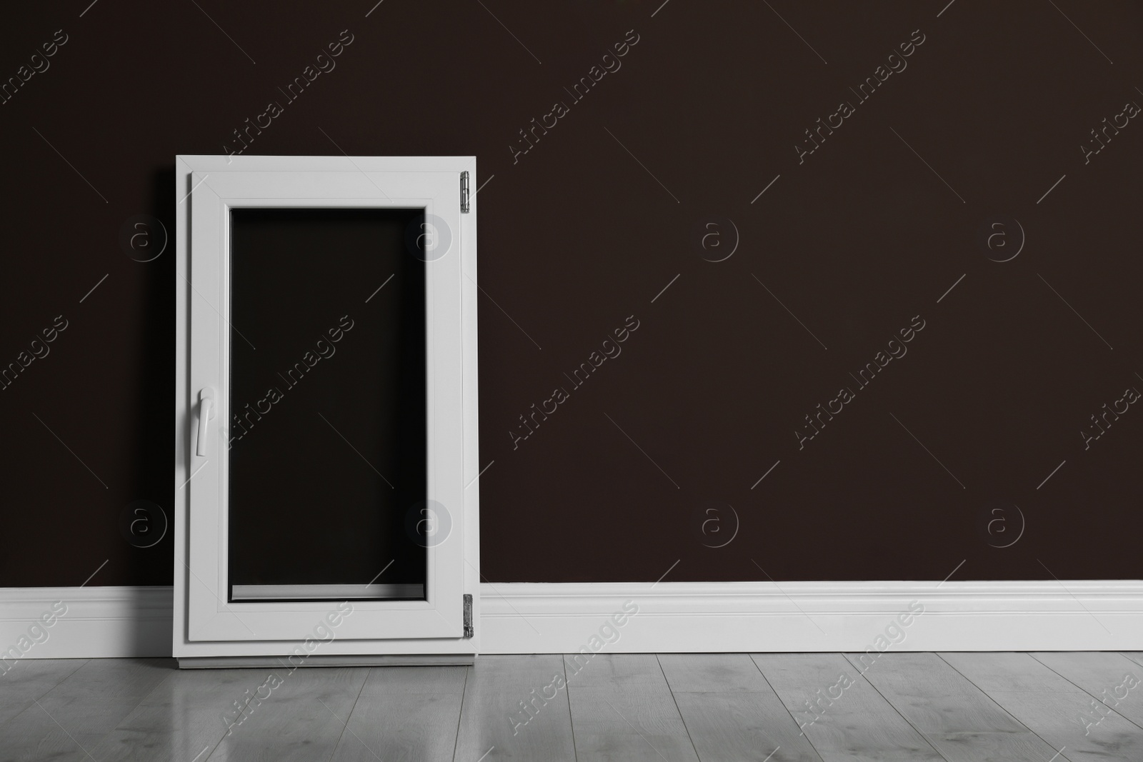 Photo of Modern single casement window near dark brown wall indoors, space for text