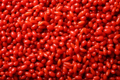 Photo of Fresh ripe goji berries as background, top view