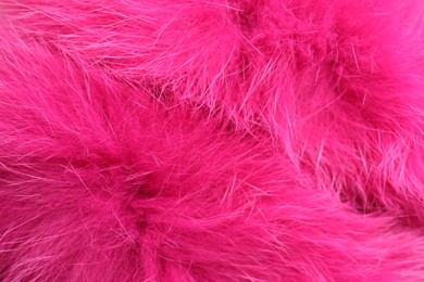 Photo of Texture of bright pink faux fur as background, closeup