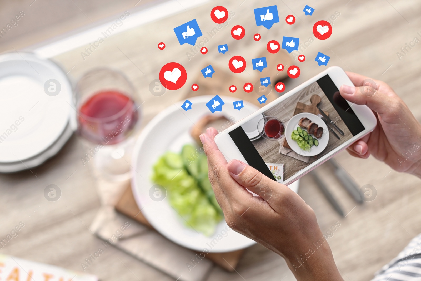 Image of Blogger taking photo of food with mobile phone, closeup