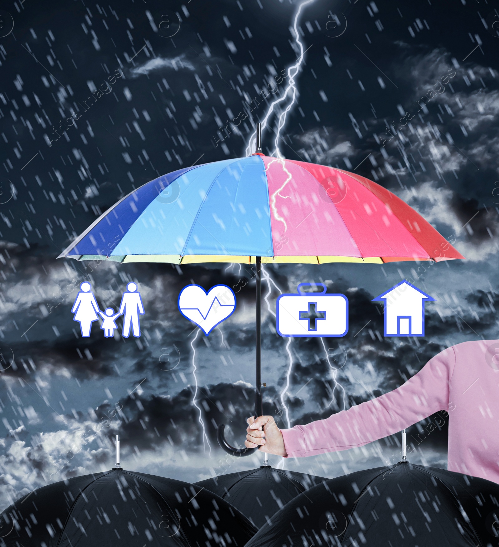 Image of Insurance agent covering illustrations with rainbow umbrella during storm