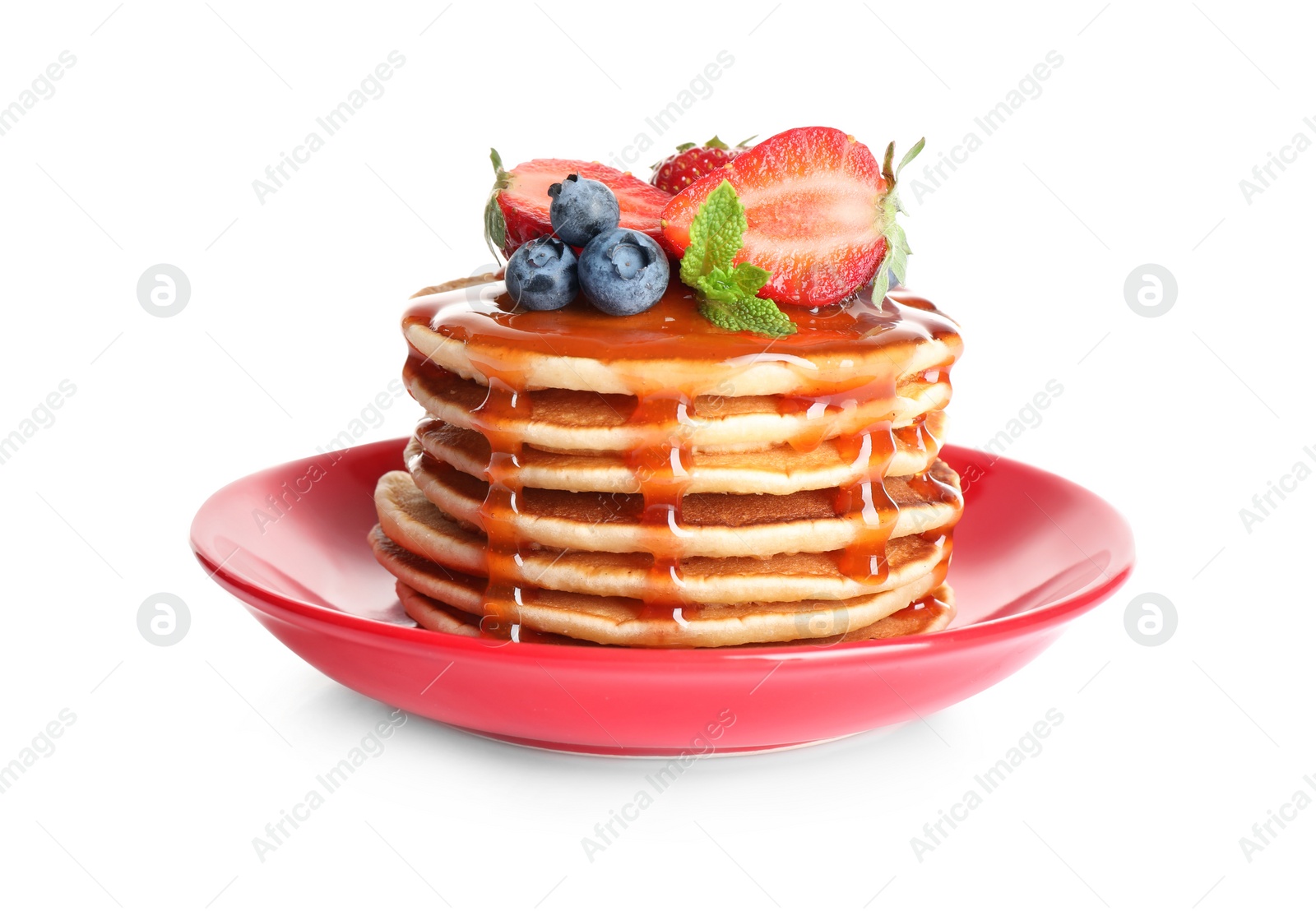 Photo of Plate of delicious pancakes with fresh berries and syrup on white background