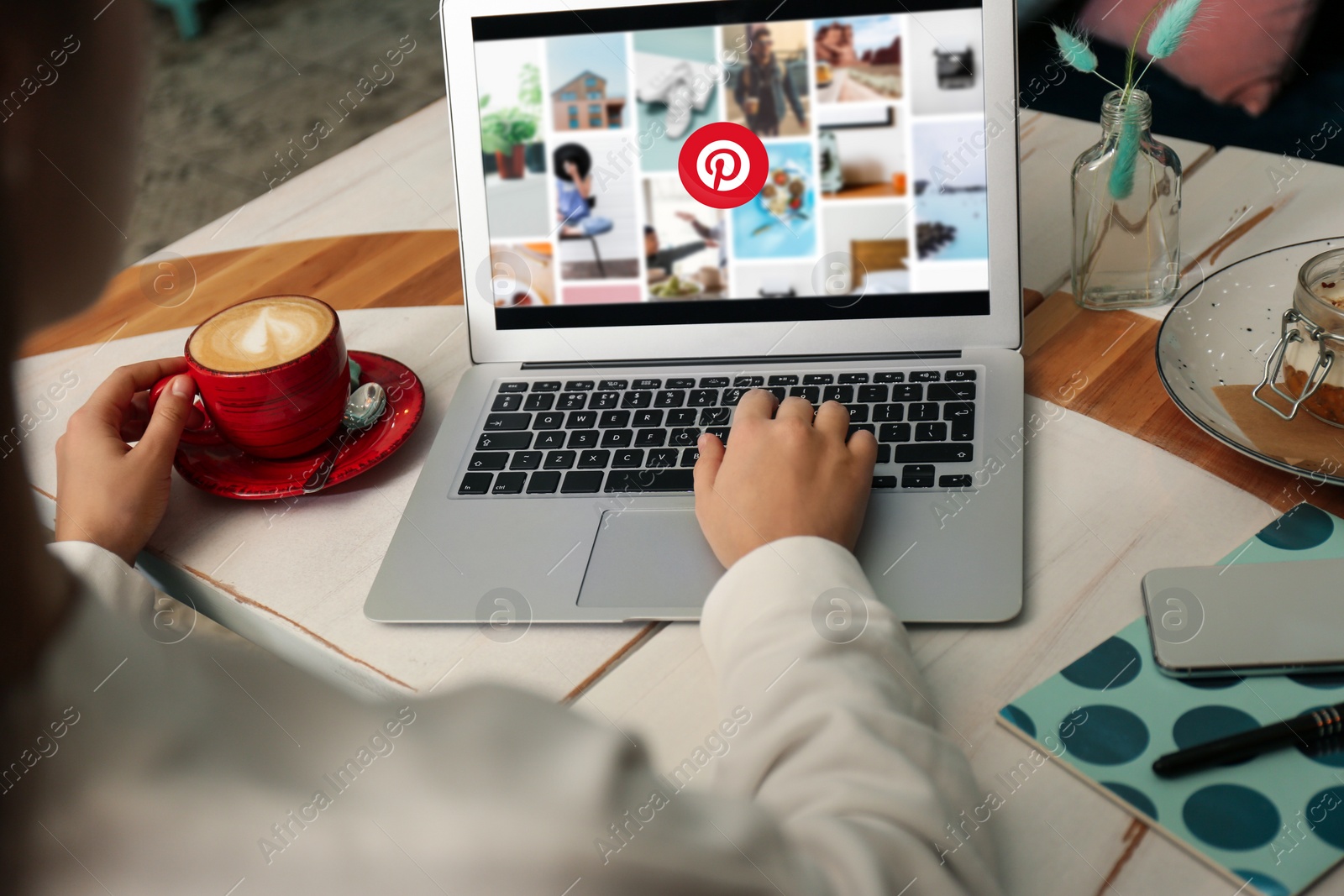 Image of MYKOLAIV, UKRAINE - MAY 4, 2020: Woman using Pinterest site on laptop indoors, closeup. Social media web