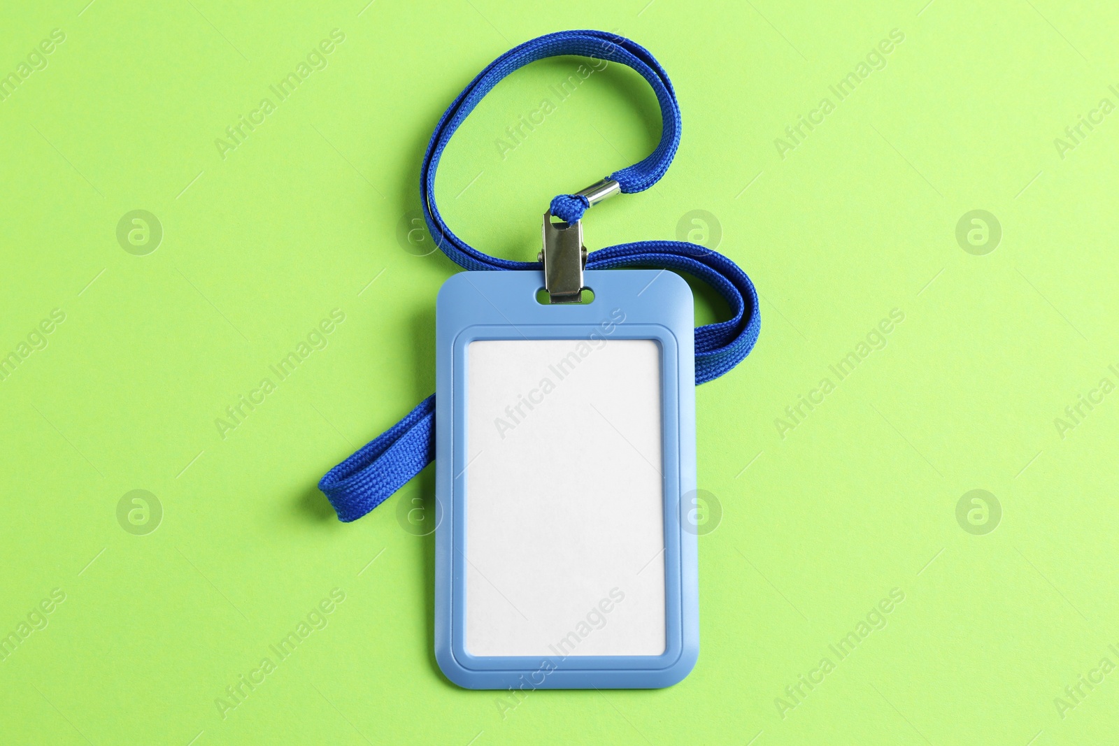 Photo of Blank badge on green background, top view. Mockup for design