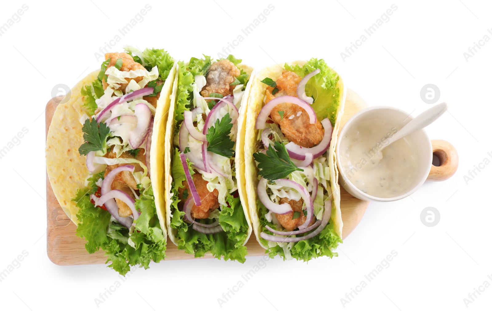 Photo of Yummy fish tacos with sauce isolated on white, top view