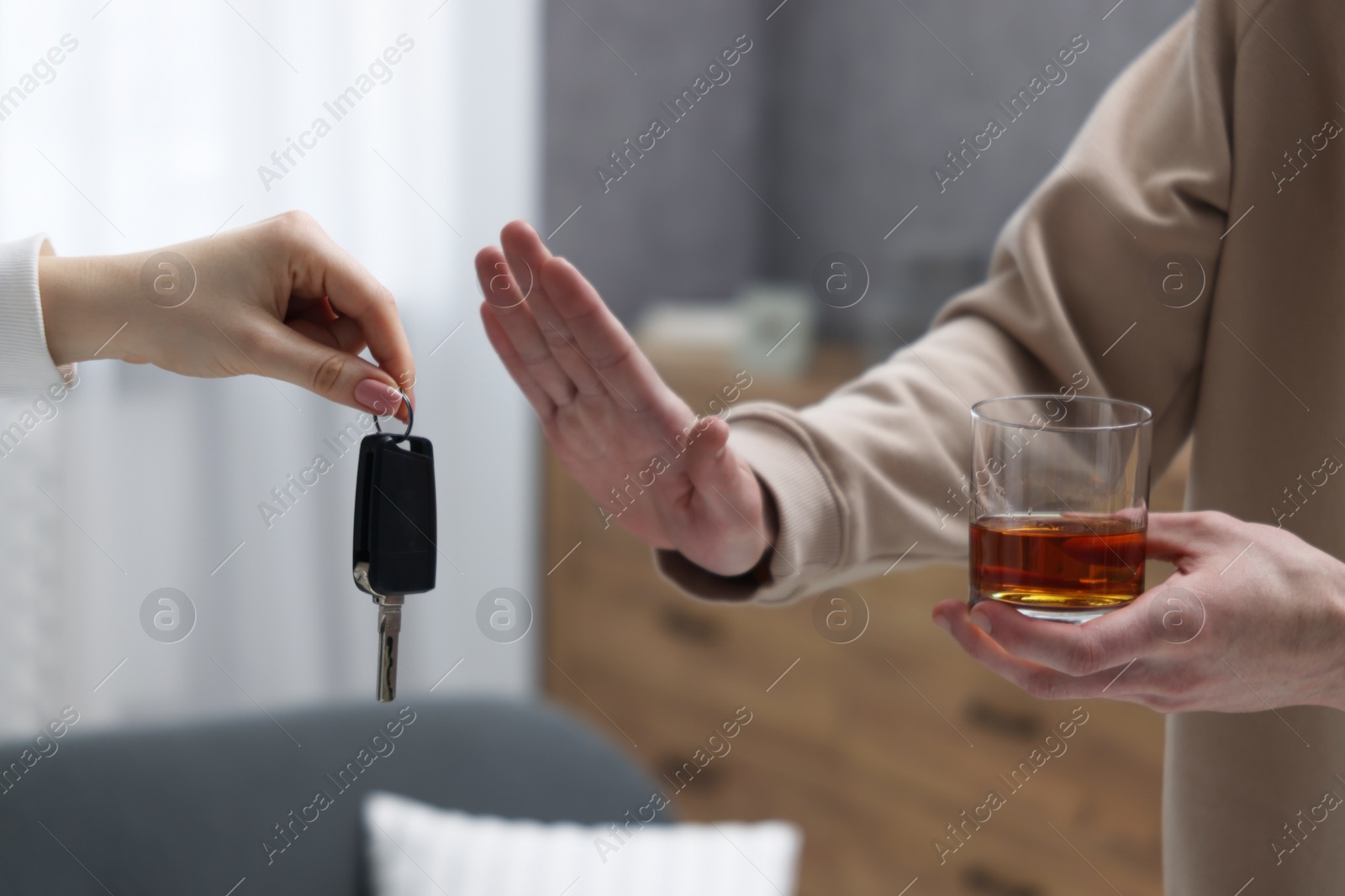 Photo of Drunk man refusing drive car while woman suggesting him keys, closeup. Don't drink and drive concept