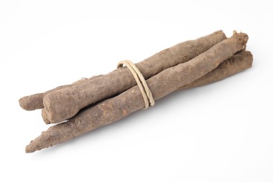 Photo of Fresh raw salsify roots on white background