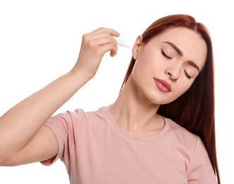 Photo of Woman using ear drops on white background