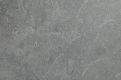 Photo of Texture of grey marble surface as background, closeup