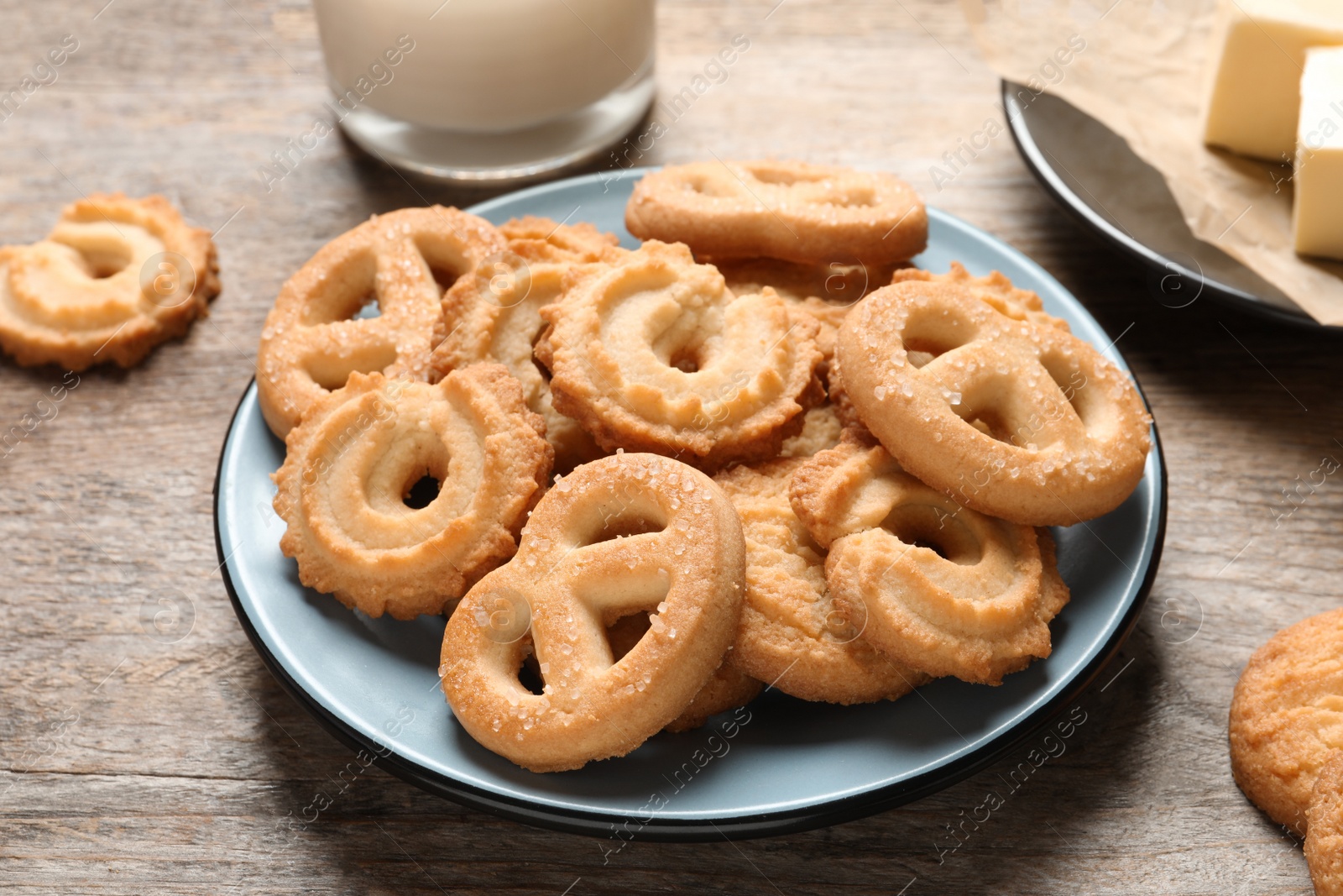 Photo of Plate with Danish butter cookies on table