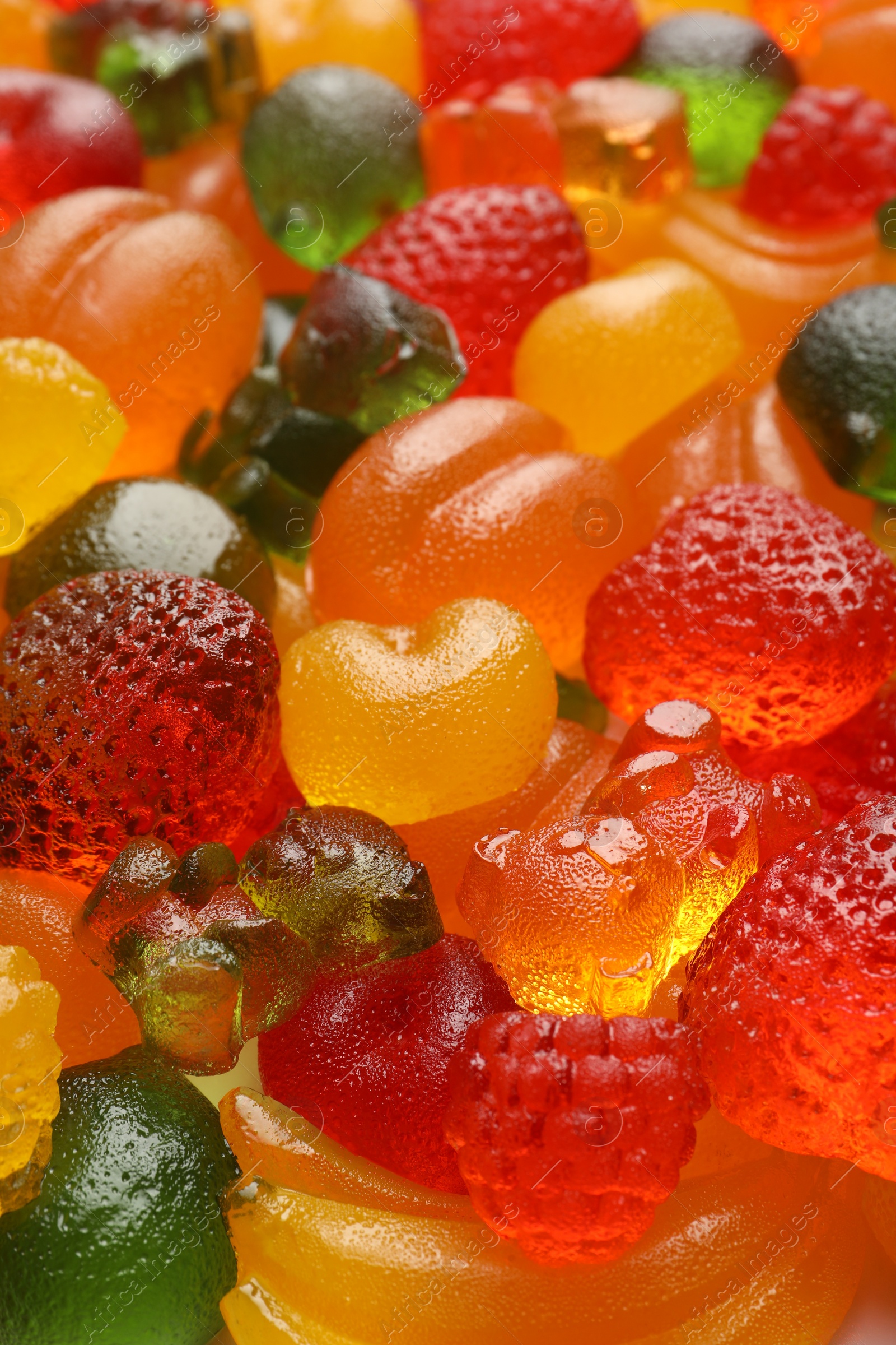 Photo of Mix of different delicious gummy candies as background, closeup