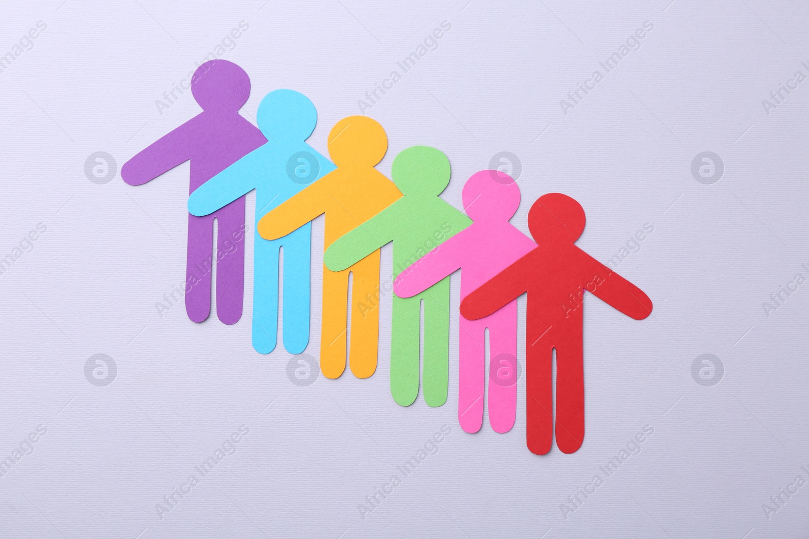 Photo of Equality concept. Paper human figures on light background, top view
