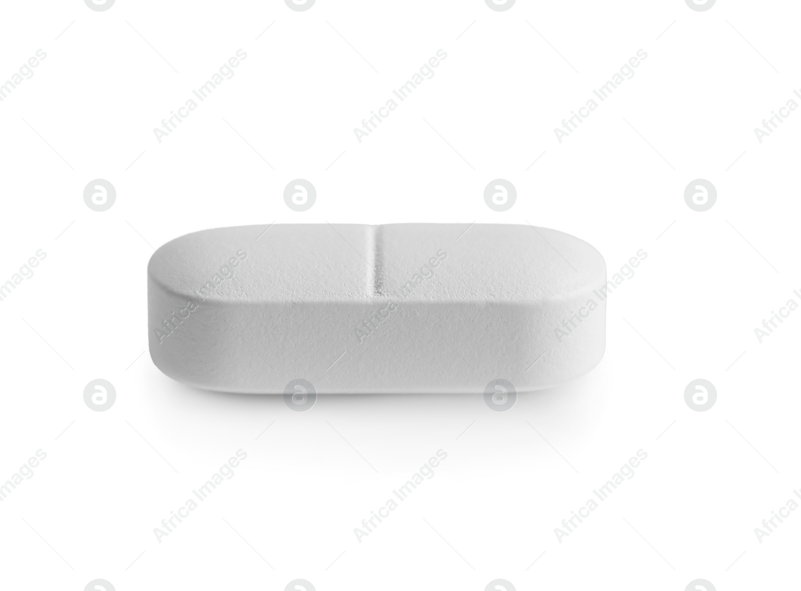 Photo of One pill on white background. Medicinal treatment