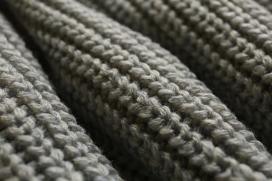 Beautiful grey knitted fabric as background, closeup