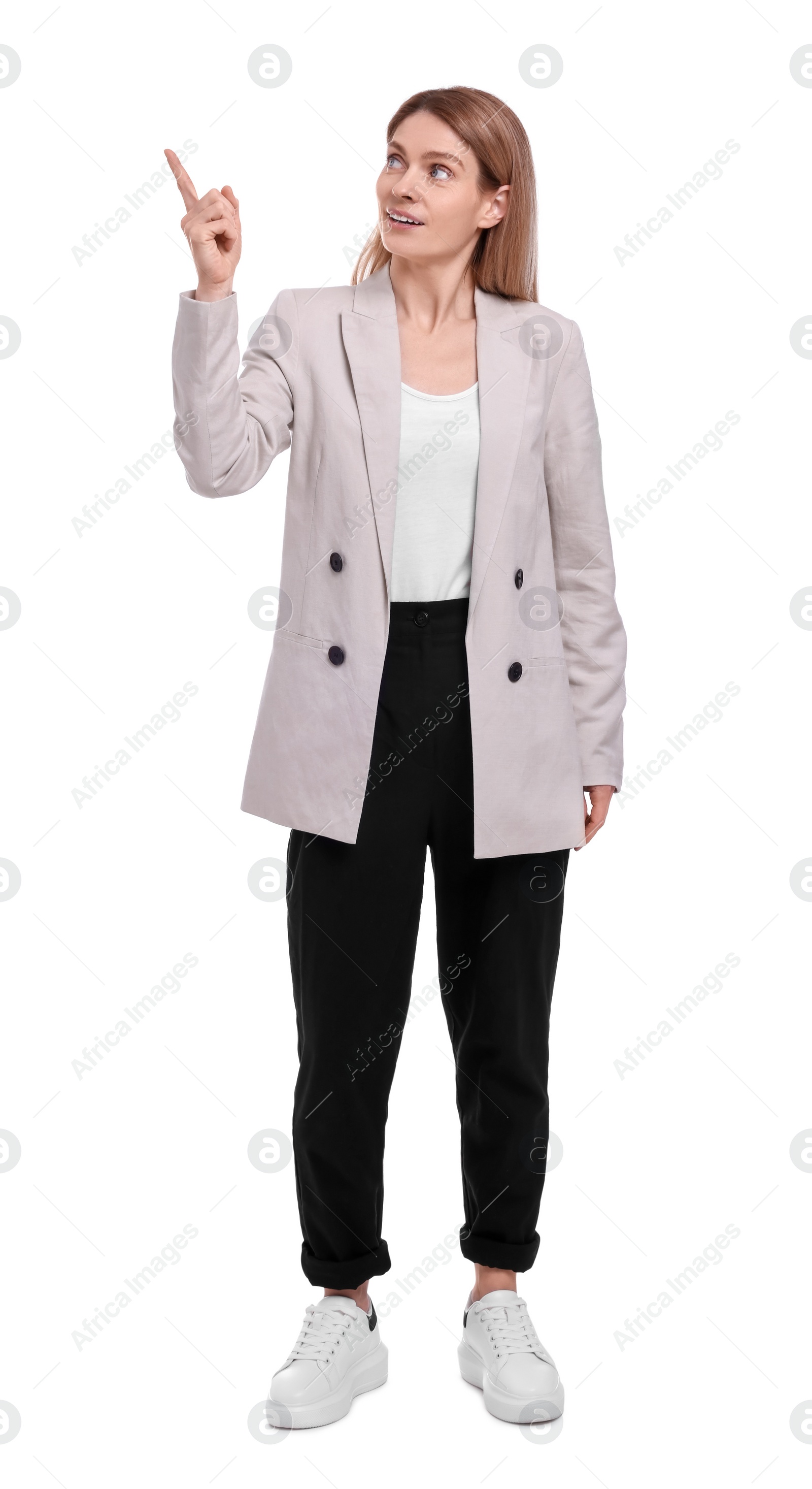 Photo of Beautiful business woman pointing at something on white background