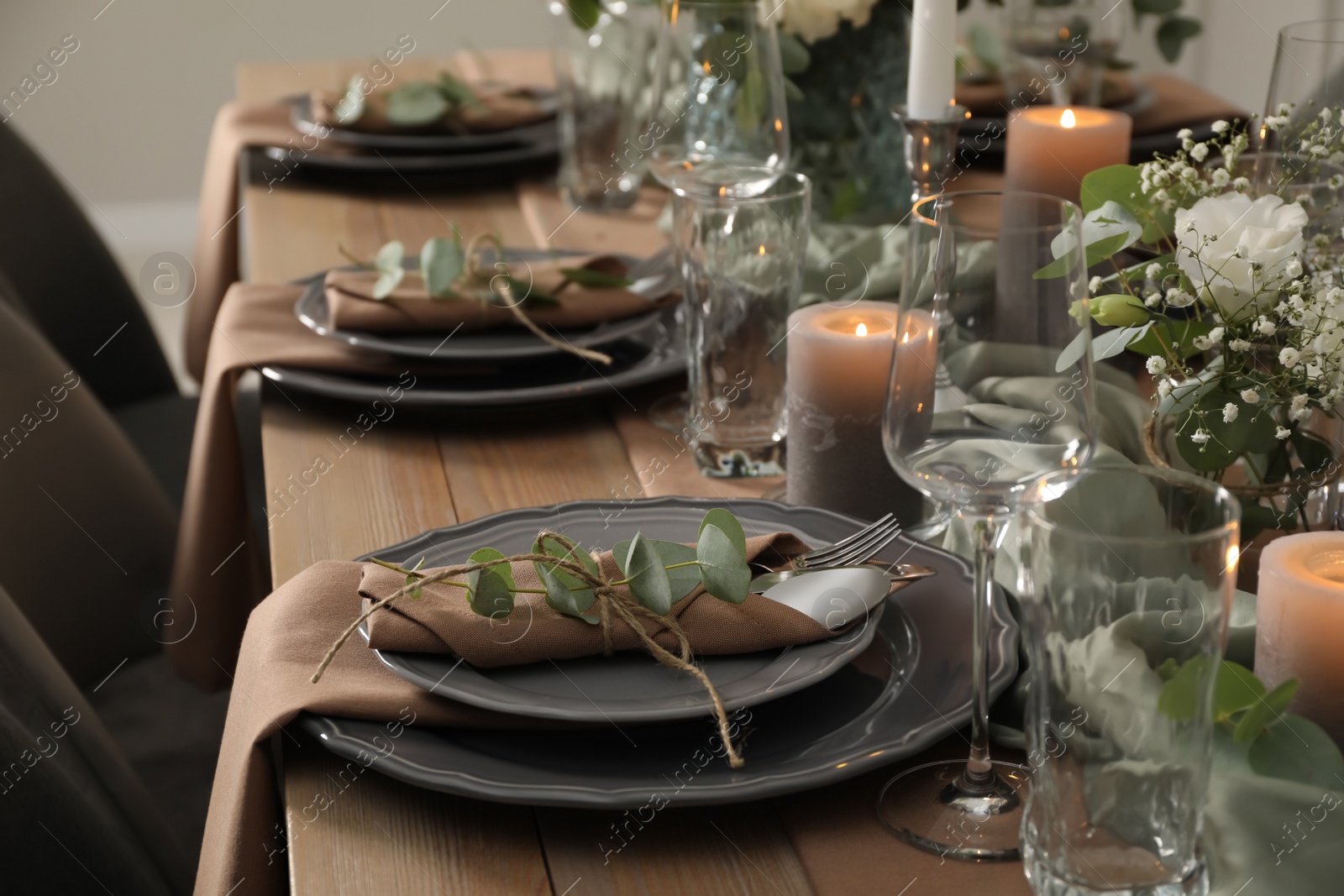 Photo of Festive table setting with beautiful floral decor indoors