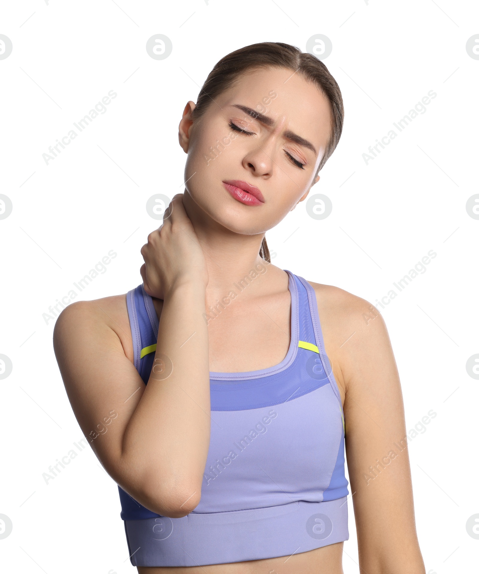 Photo of Young woman suffering from neck pain on white background