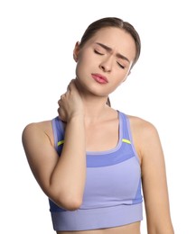Photo of Young woman suffering from neck pain on white background