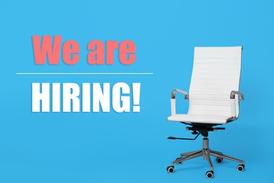 Image of We`re hiring! White office chair on light blue background