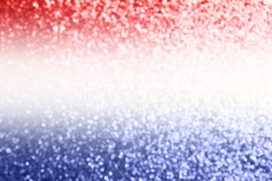 4th of July - USA Independence Day. Blurred view of glitters in colors of American national flag, bokeh effect 