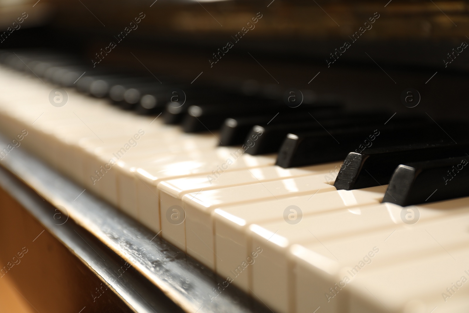 Photo of Modern piano with black and white keys, closeup