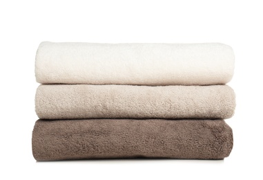 Photo of Folded soft terry towels on white background