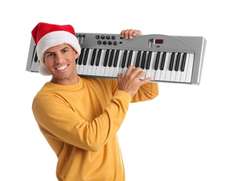 Photo of Man in Santa hat playing synthesizer on white background. Christmas music