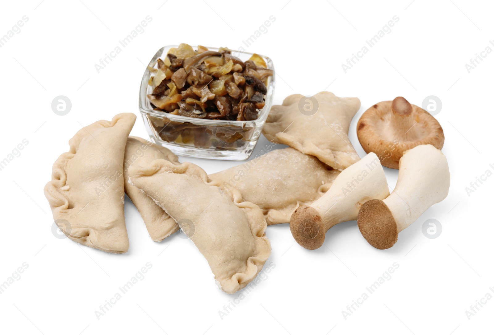 Photo of Raw dumplings (varenyky) and mushrooms isolated on white