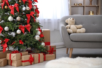 Room interior with beautiful Christmas tree and gifts