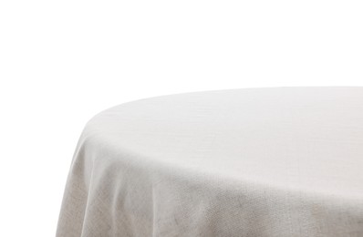 Photo of Table with light tablecloth isolated on white