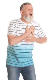 Mature man having heart attack on white background