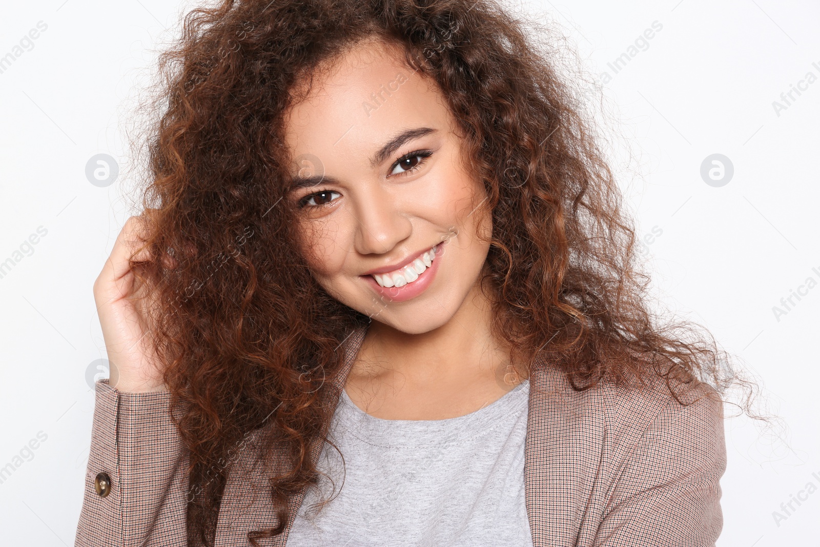 Photo of Young African-American woman with beautiful face on white background, closeup