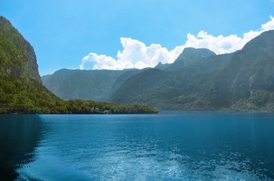 Picturesque view of river and mountains on sunny day