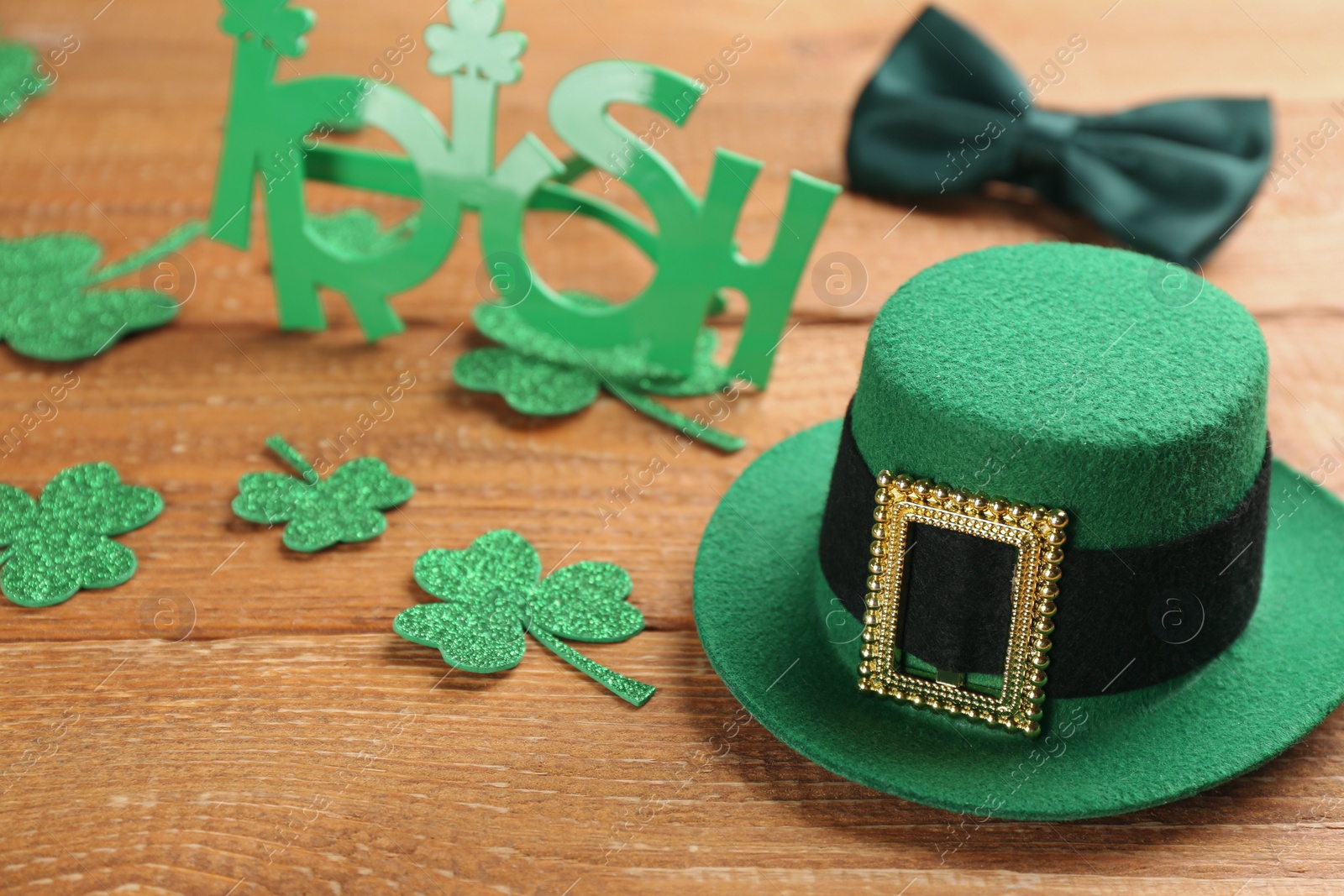 Photo of Leprechaun's hat and St. Patrick's day decor on wooden table