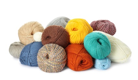 Photo of Different balls of woolen knitting yarns on white background