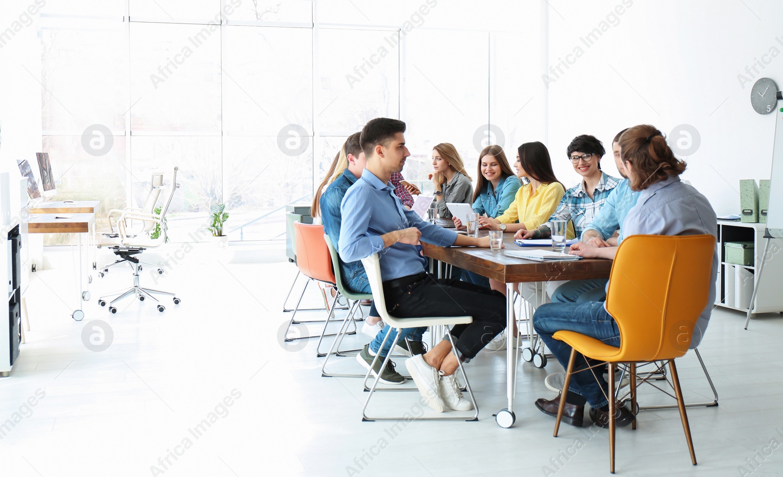 Photo of Young people having business training in office