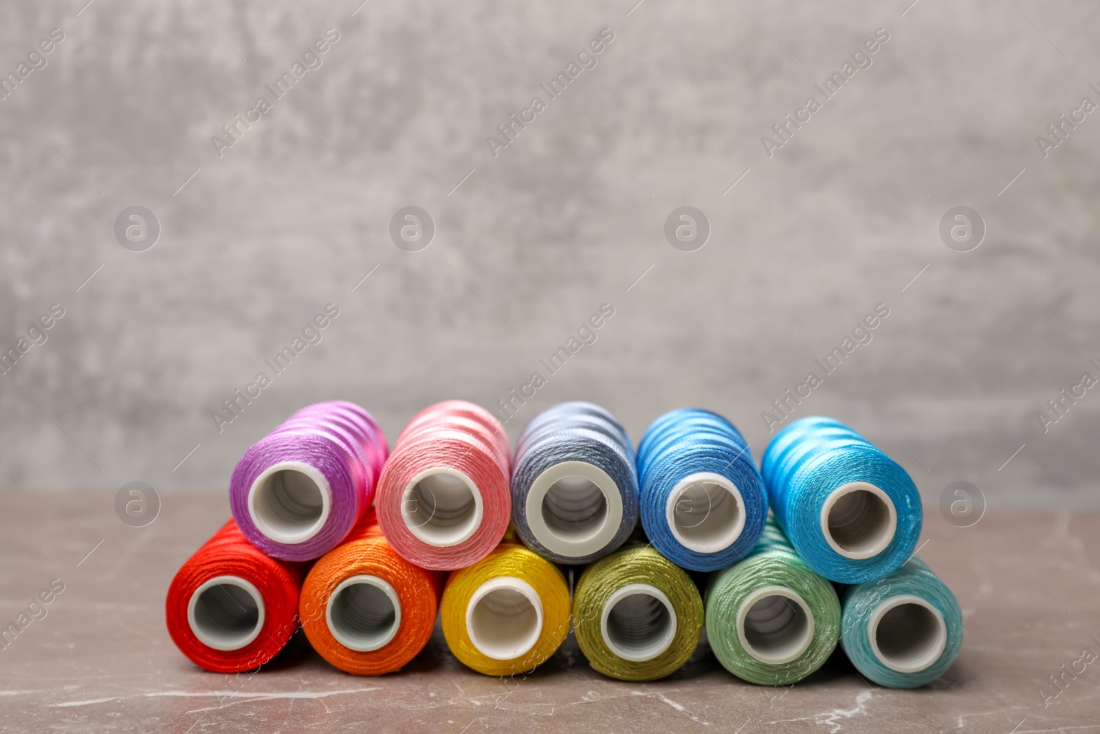 Photo of Color sewing threads on table
