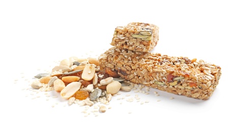 Grain cereal bars with nuts and raisins on white background