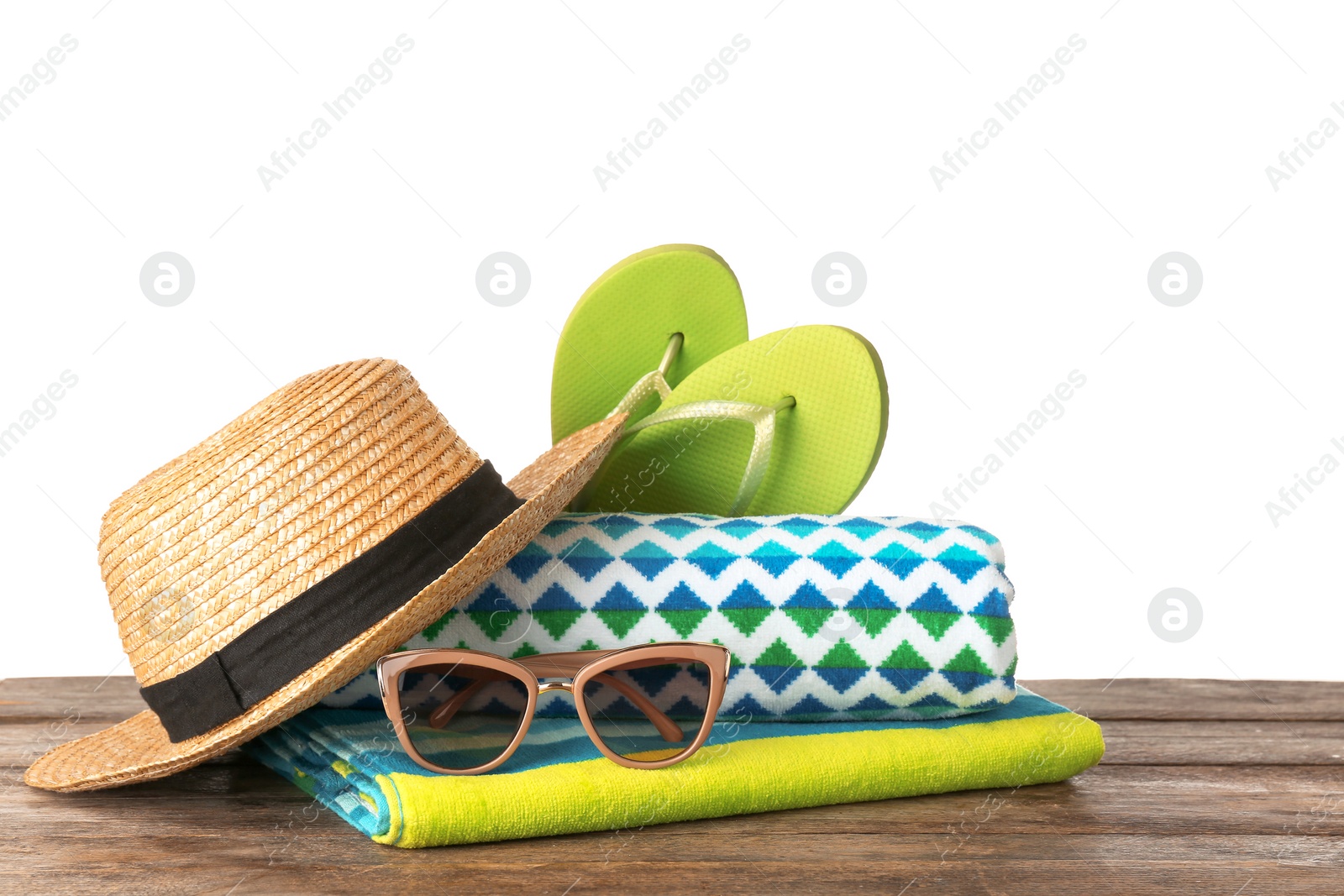 Photo of Set of different beach accessories on table against white background. Space for text