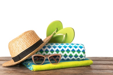 Photo of Set of different beach accessories on table against white background. Space for text