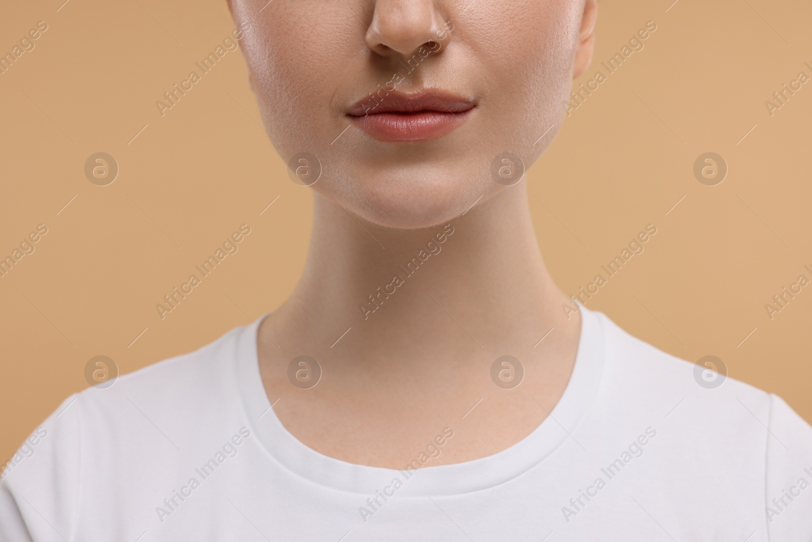 Photo of Beauty concept. Woman on beige background, closeup