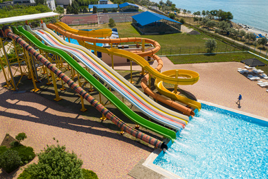 Image of Aerial view of water park on sunny day