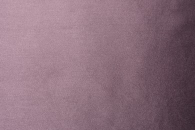 Photo of Dark purple silk fabric as background, top view