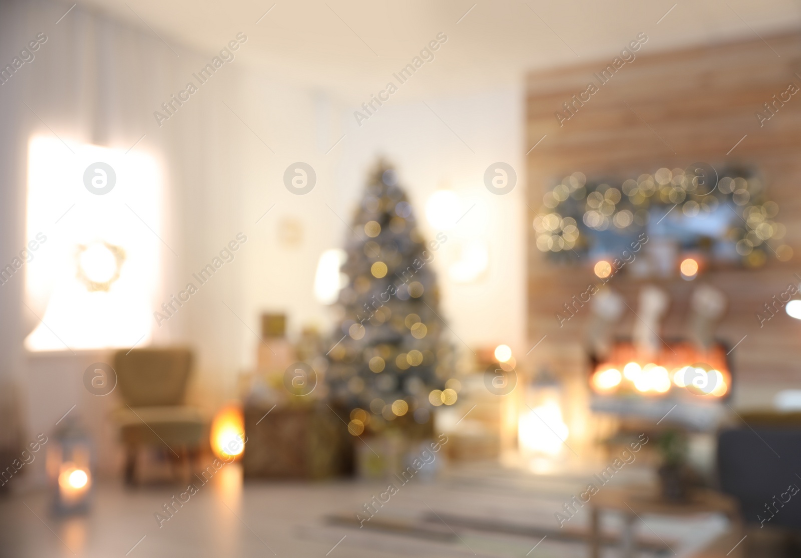 Photo of Blurred view of living room interior with decorated Christmas tree