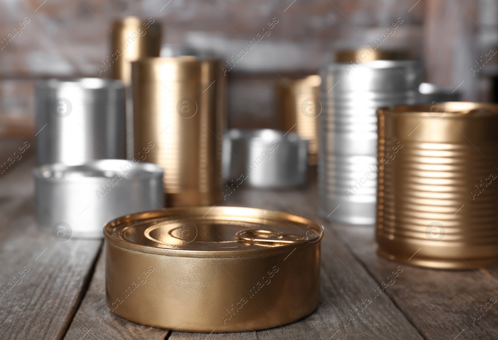 Photo of Many tin cans on table. Recycling garbage