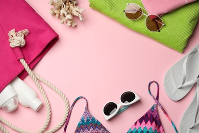 Photo of Flat lay composition with beach accessories on color background. Space for text